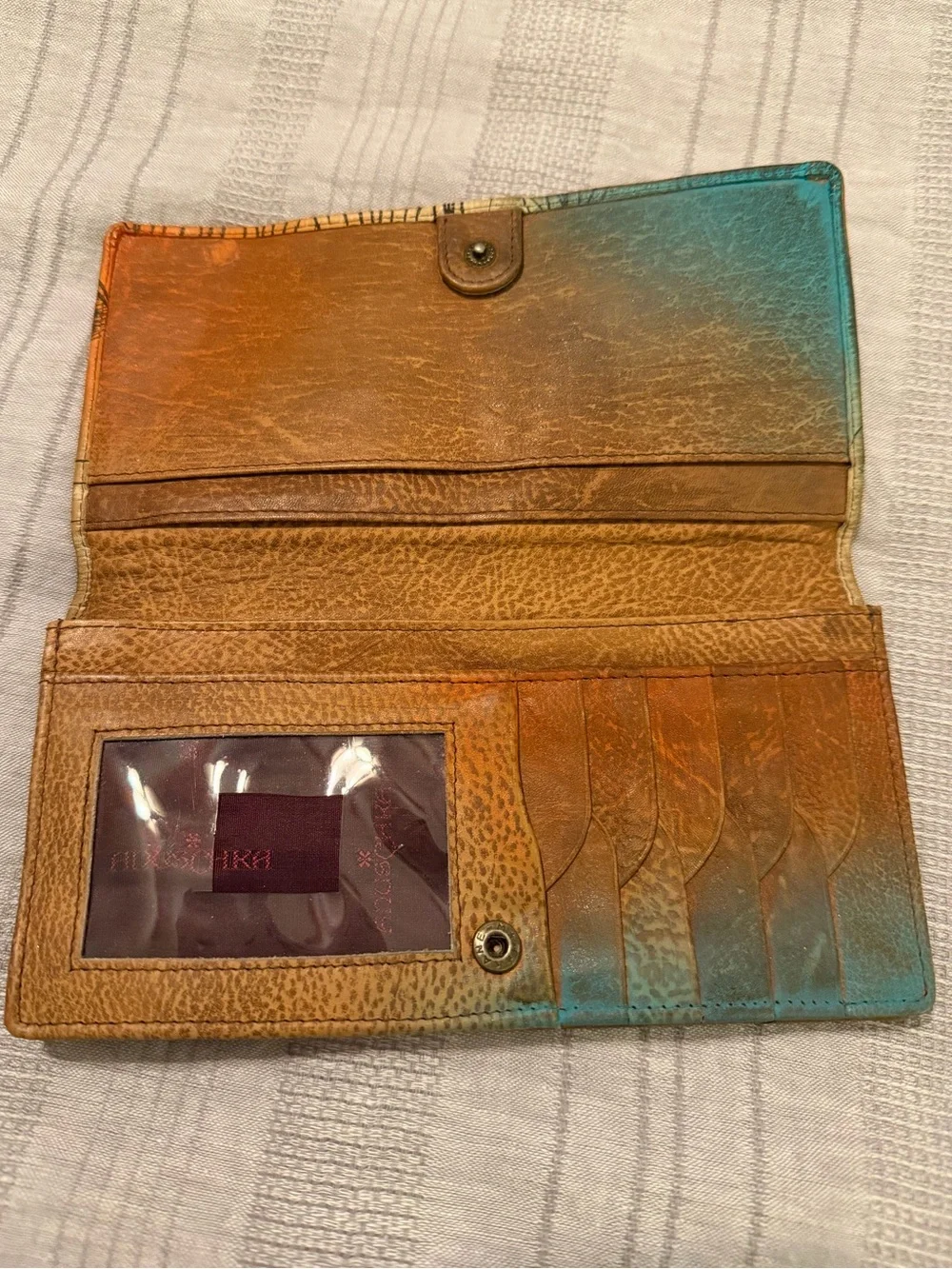 Anuschka hand-painted leather wallet featuring a vibrant 